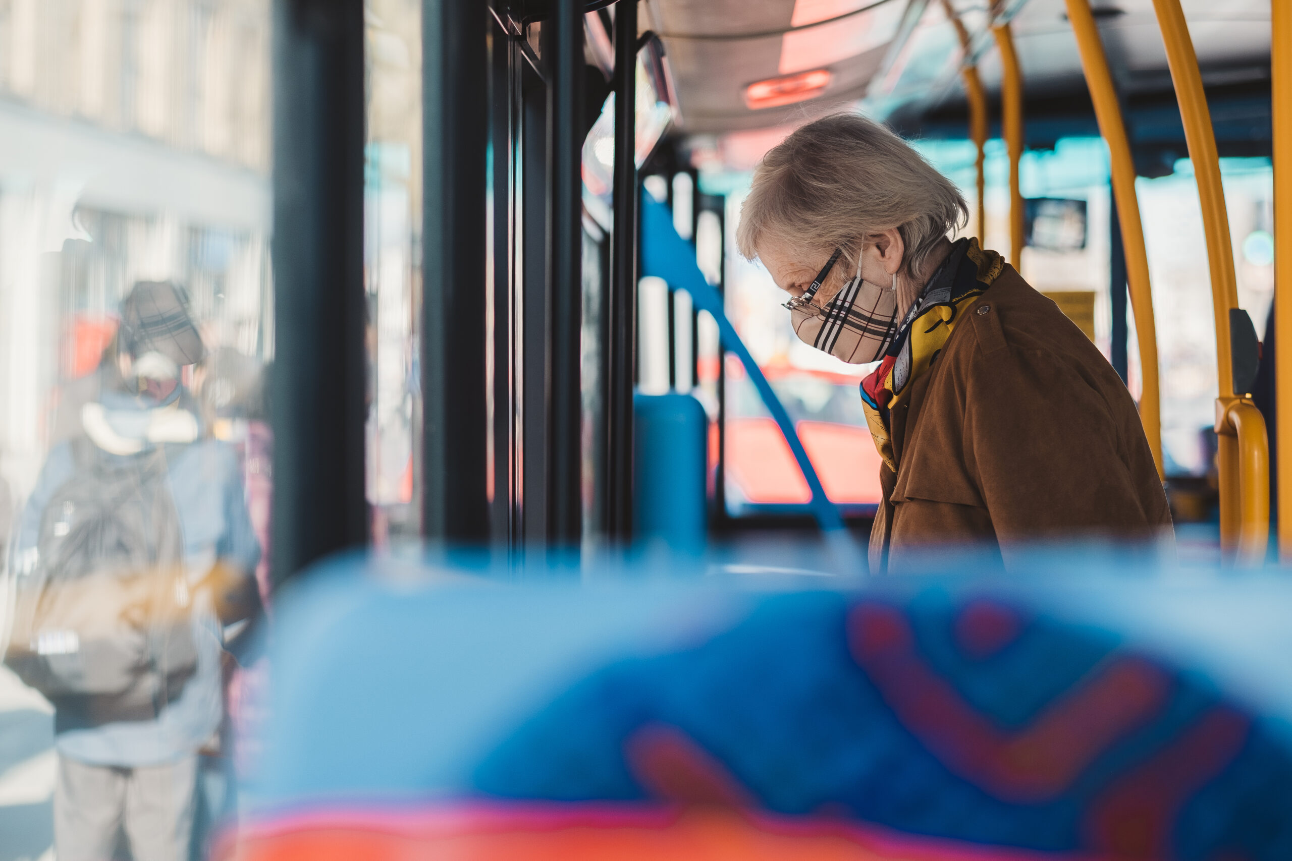 Elderly woman departing bus