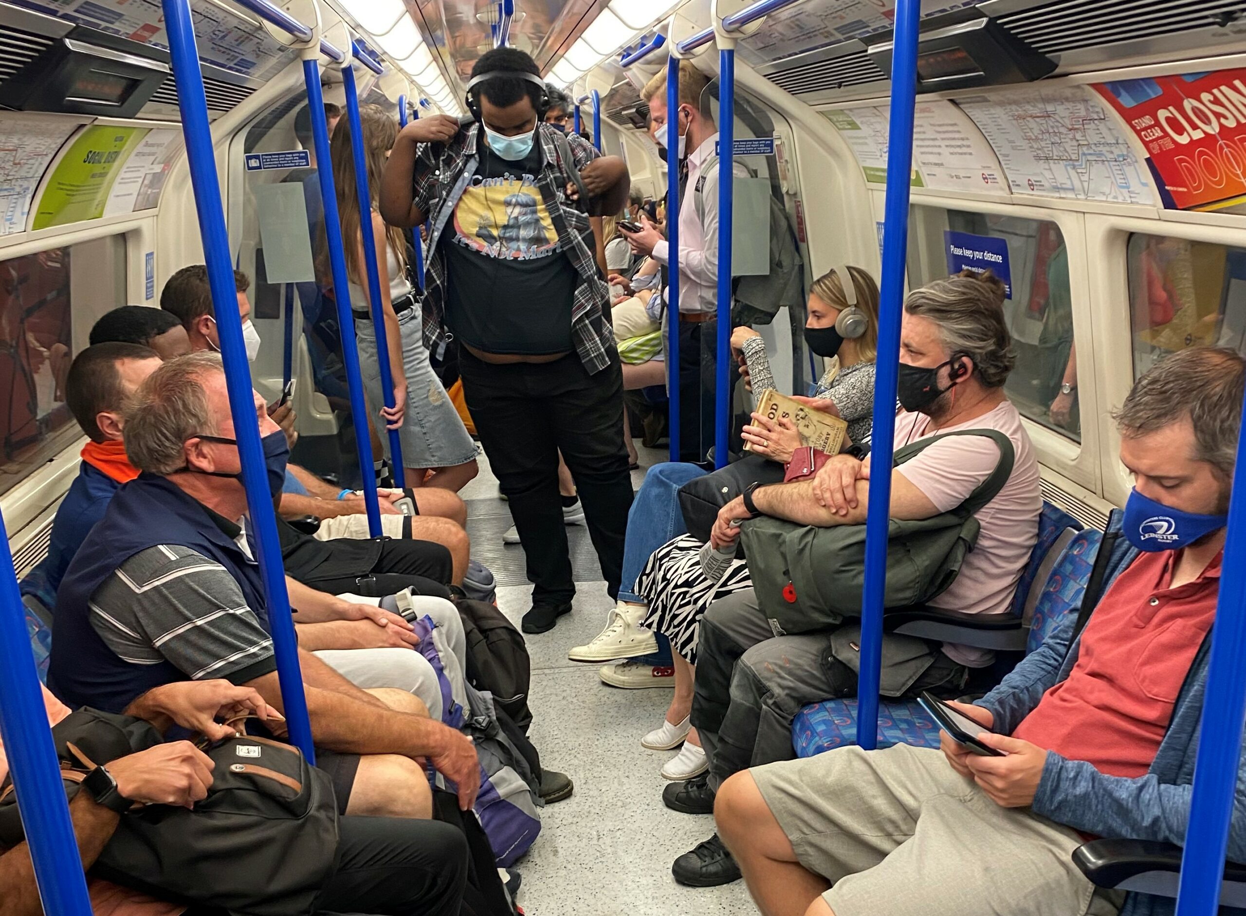 Tube passengers with face coverings