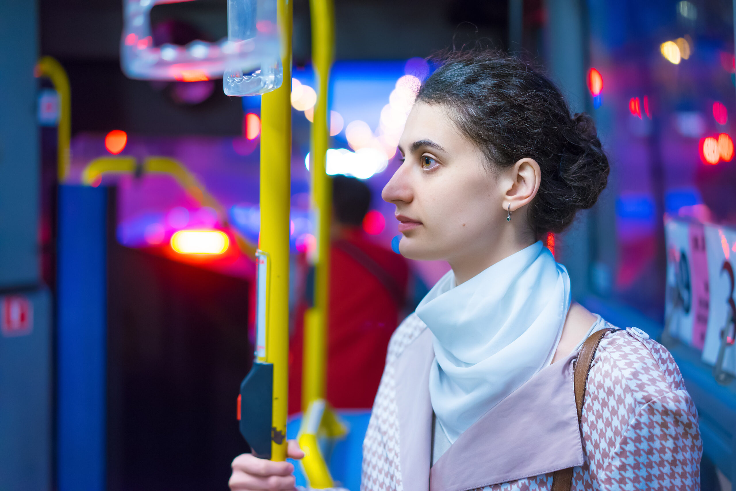 Woman on bus at night