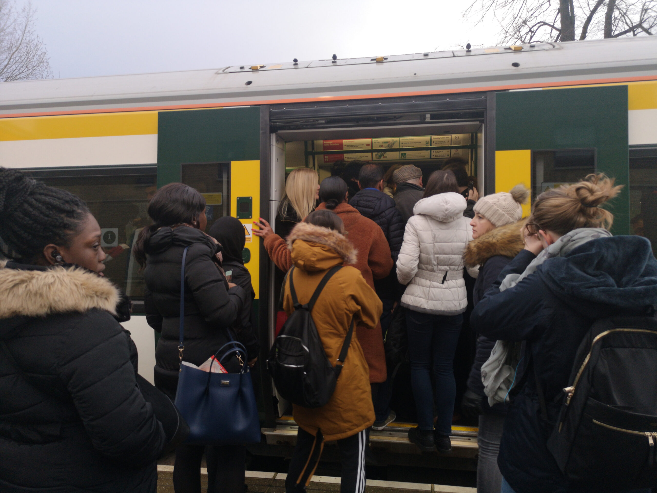 Passengers boarding a crowded Southern Rail train