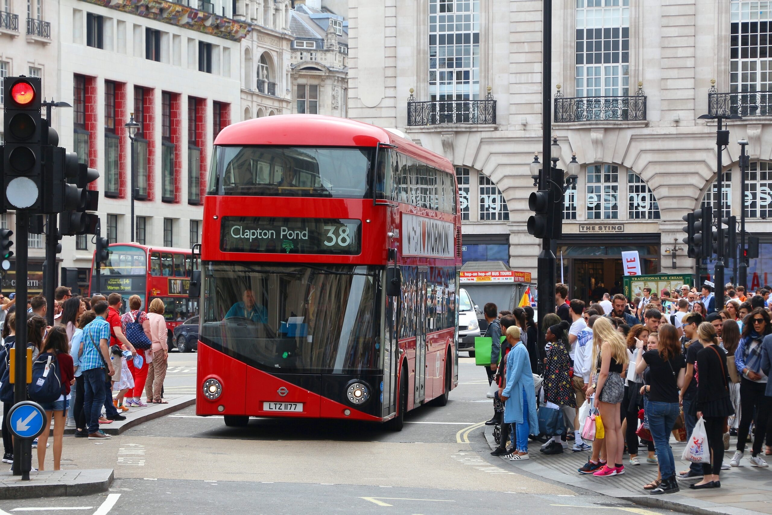 London bus with pedestrians