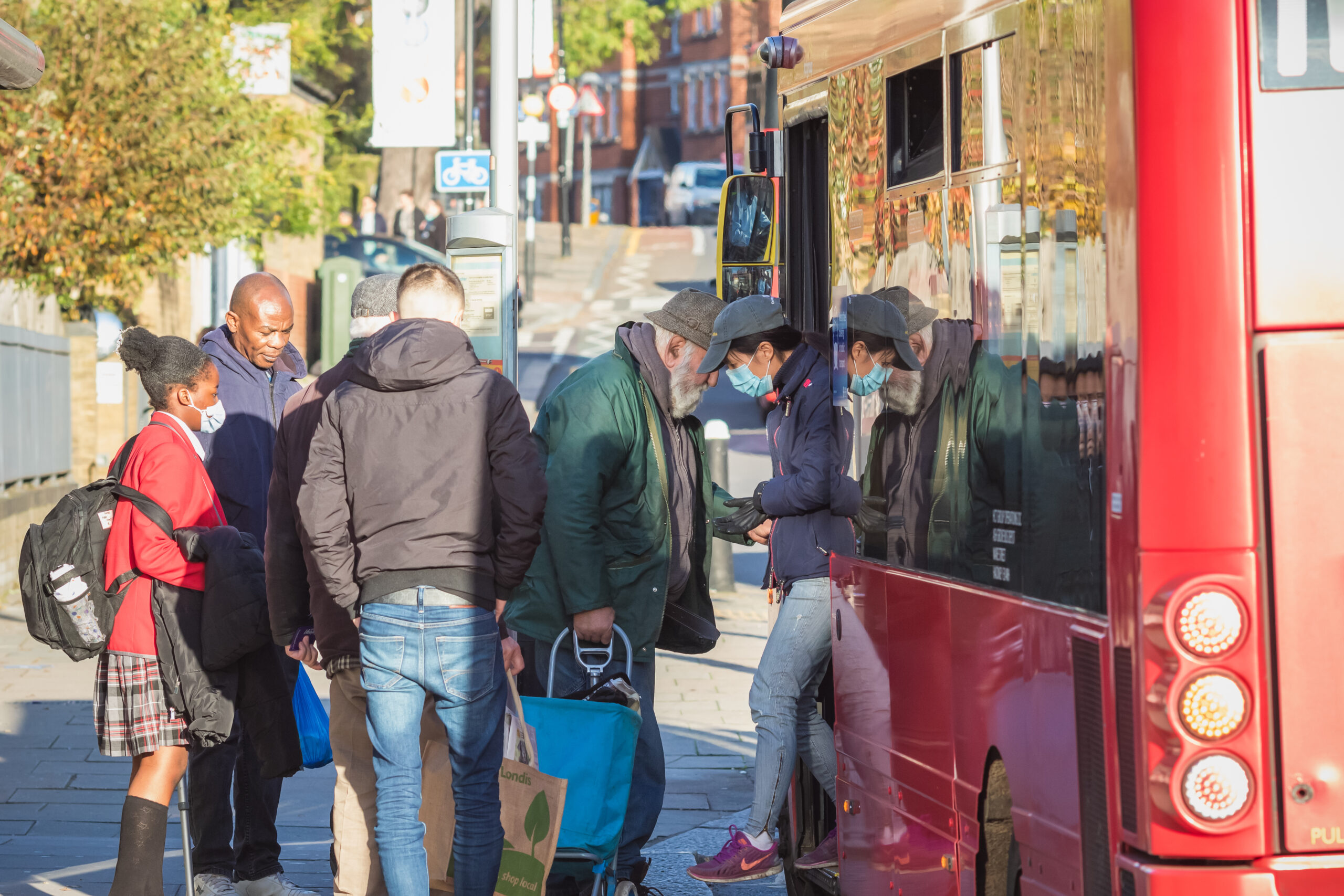 People getting on to bus