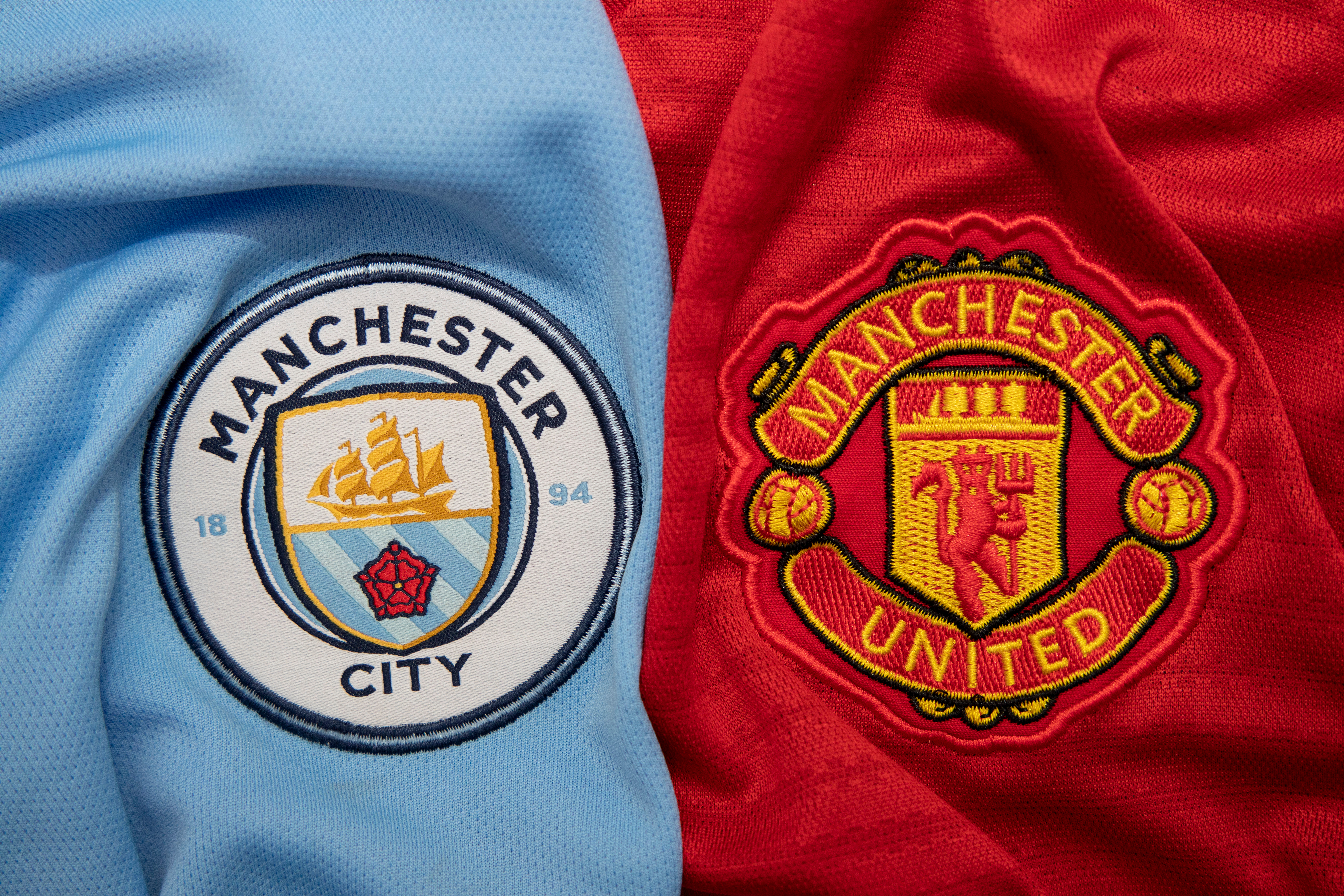 Man City and Man United Shirt Badges