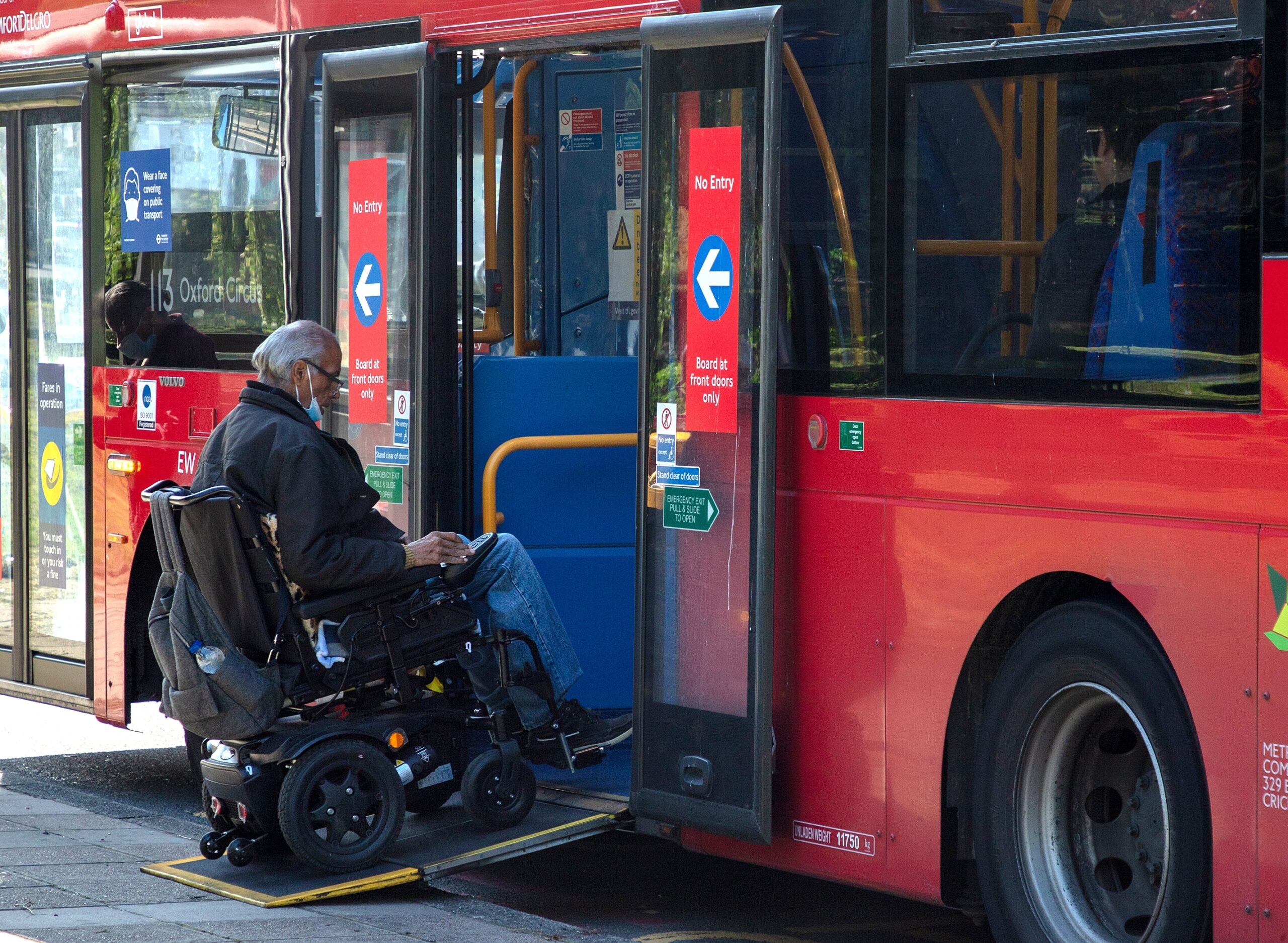Wheelchair user boarding London bus - transport advice page