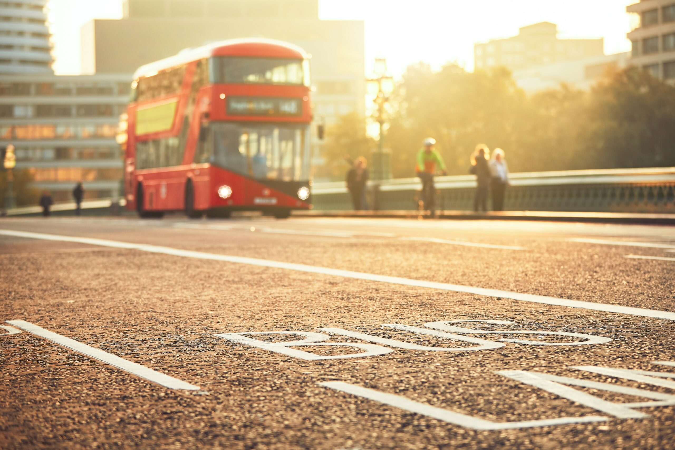 Bus on bridge in London at sunset