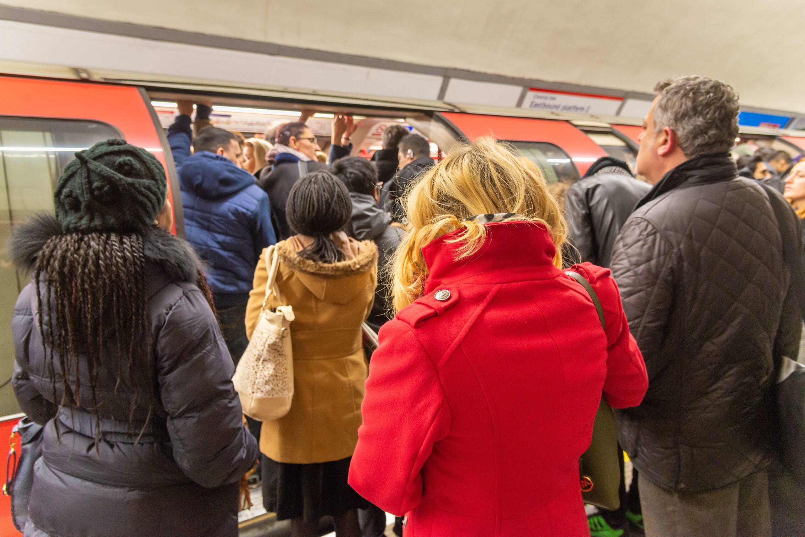 Passengers boarding busy Central line train