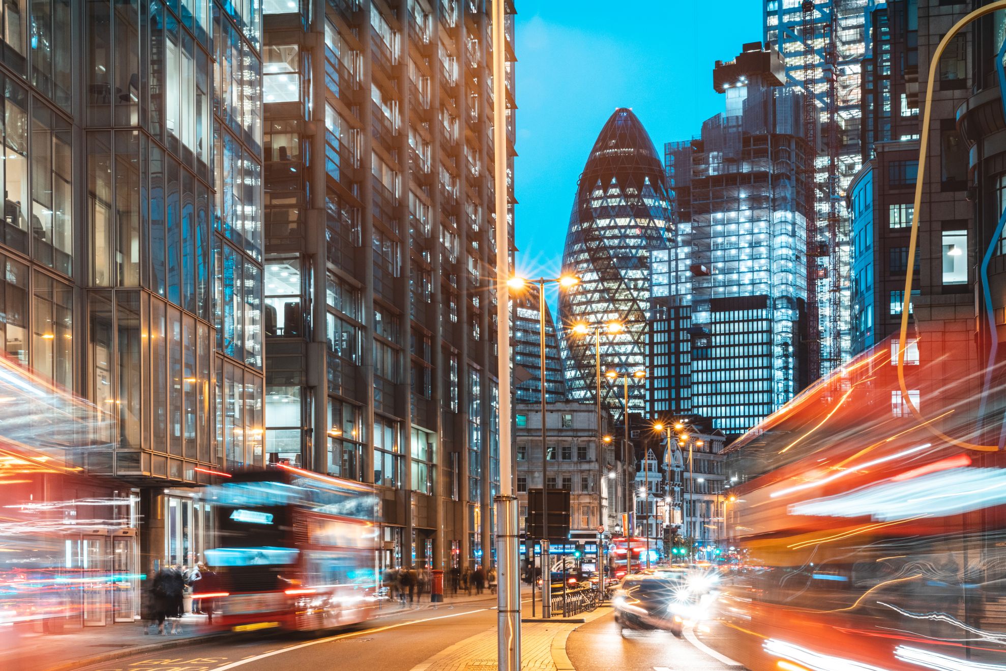Buses speeding with Gherkin in the background