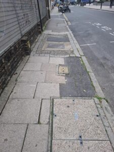 A narrow and uneven pavement