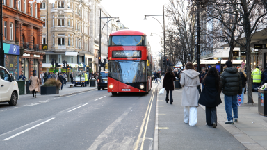The 390 bus to Archway travelling along Oxford Street