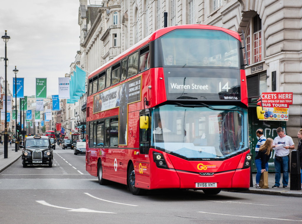 A number 14 red London bus travelling in central London